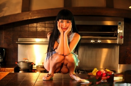 Japanese housewife Marica Hase releases her tits and twat from an apron 53042821