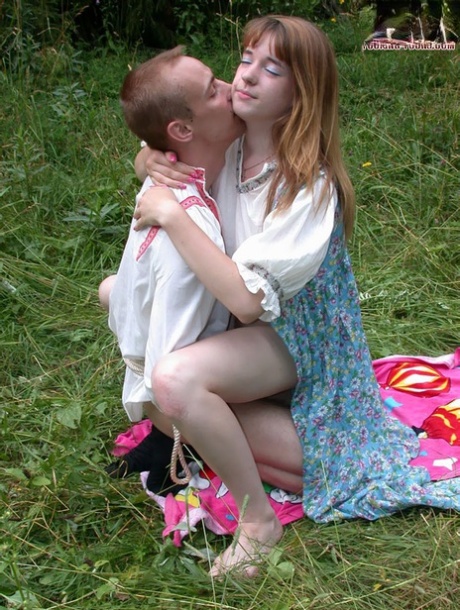 Russian teen with red hair rides her boyfriend's cock during sex in long grass 89129916