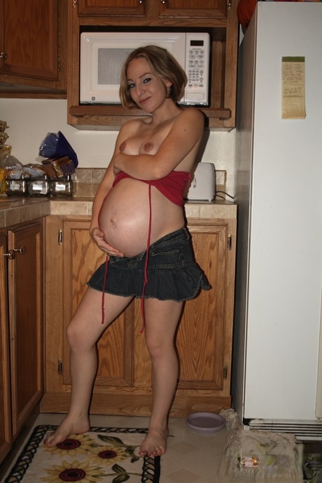 Pregnant amateur Kristi bares her butt before toying her twat in the kitchen 36487091