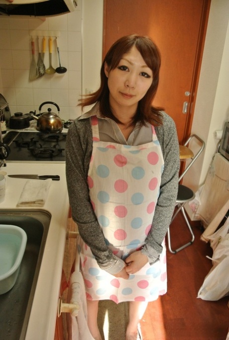 Japanese housewife Eri Fujino shows her tits and ass in an apron 95165580