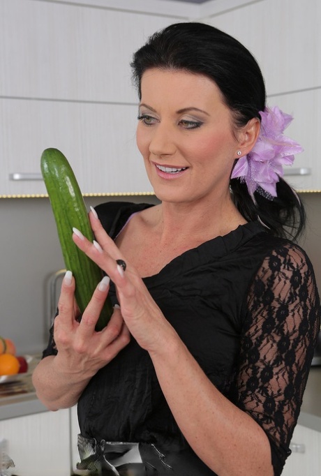 Hot brunette MILF toying bald beaver with cucumber close up in the kitchen 33317649