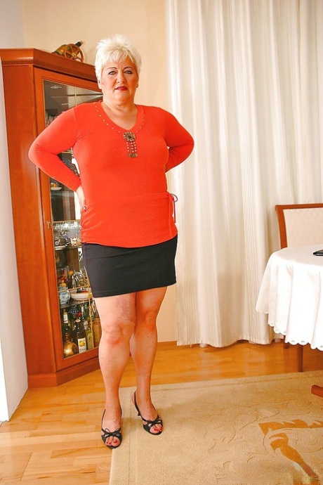 Short haired fatty granny with flabby boobs stripping off her clothes 24808021