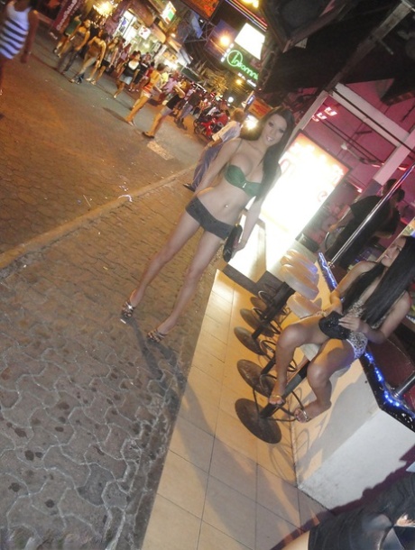 Sexy Thai shemale Army shows off her big tranny tits on public street 20884018